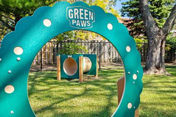A green archway with the words "Green Paws" on it.